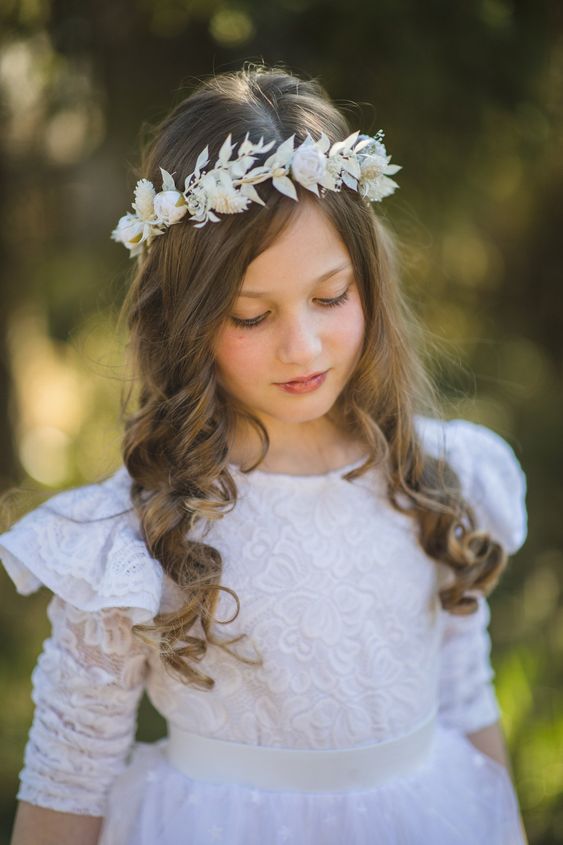 Chignon and Flower Clip First Communion Hairstyles